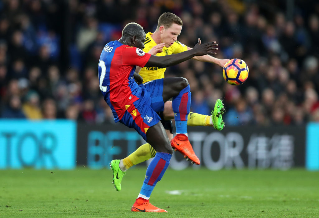 LONDON, ENGLAND - FEBRUARY 25: Mamadou Sakho of Crystal Palace (L) and Adam Forshaw of Middlesbrough (R) battle for possession during the Premier League match between Crystal Palace and Middlesbrough at Selhurst Park on February 25, 2017 in London, England. (Photo by Christopher Lee/Getty Images)