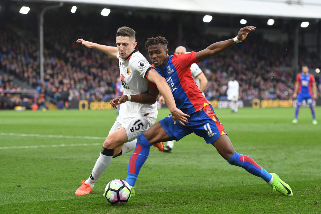 LONDON, ENGLAND - MARCH 18: Craig Cathcart of Watford (L) and Wilfried Zaha of Crystal Palace (R) battle for possession during the Premier League match between Crystal Palace and Watford at Selhurst Park on March 18, 2017 in London, England.  (Photo by Mike Hewitt/Getty Images)