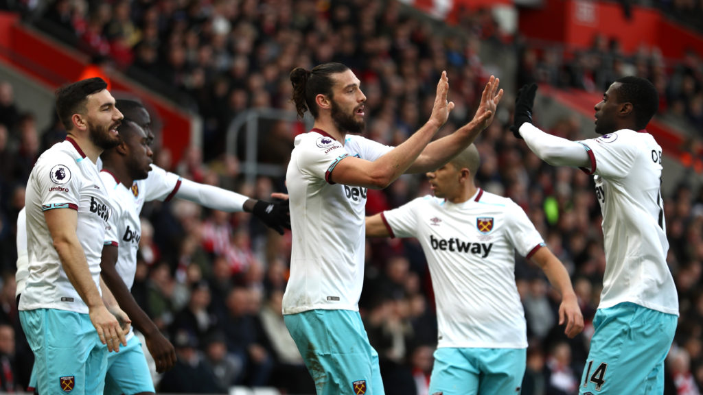 SOUTHAMPTON, ENGLAND - FEBRUARY 04:  Andy Carroll of West Ham United (C) celebrates scoring his sides first goal with Pedro Obiang of West Ham United (R) and his West Ham United team mates during the Premier League match between Southampton and West Ham United at St Mary's Stadium on February 4, 2017 in Southampton, England.  (Photo by Bryn Lennon/Getty Images)