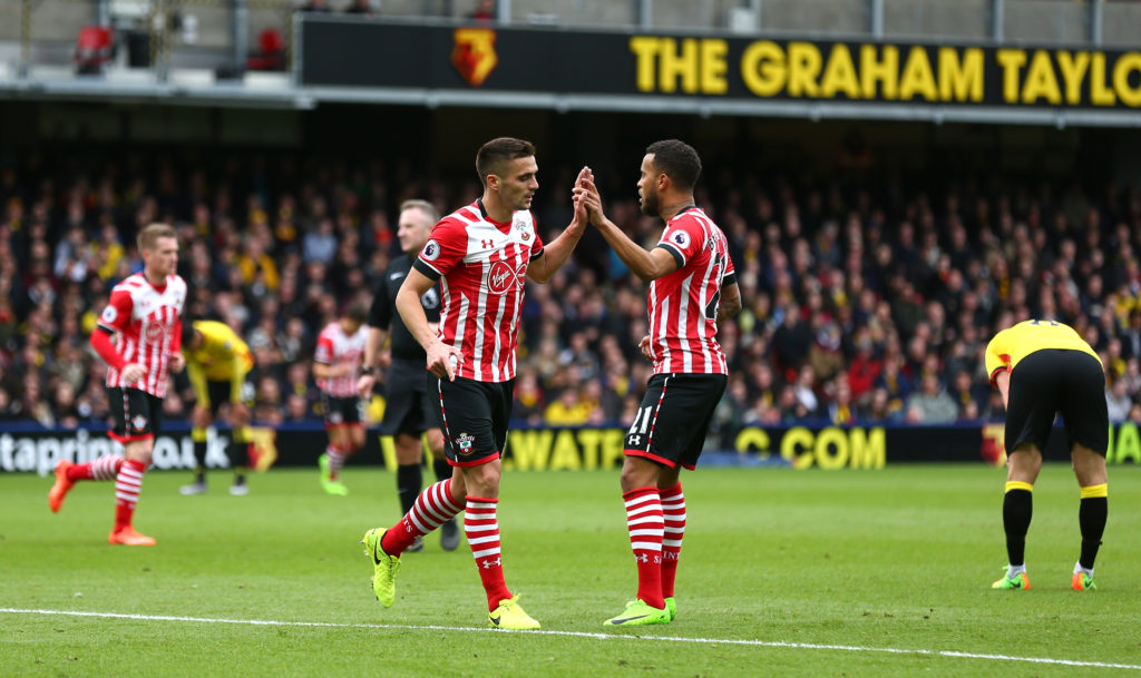 WATFORD, ENGLAND - MARCH 04: Dusan Tadic of Southampton (L) celebrates scoring his sides first goal with Ryan Bertrand of Southampton (R) during the Premier League match between Watford and Southampton at Vicarage Road on March 4, 2017 in Watford, England. (Photo by Steve Bardens/Getty Images)