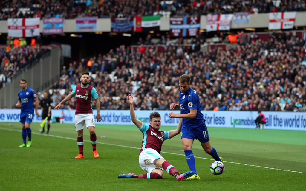 STRATFORD, ENGLAND - MARCH 18: Sam Byram of West Ham tackles Marc Albrighton of Leicester City during the Premier League match between West Ham United and Leicester City at London Stadium on March 18, 2017 in Stratford, England. (Photo by Catherine Ivill - AMA/Getty Images)