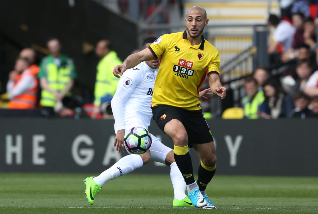 WATFORD, ENGLAND - APRIL 15: Nordin Amrabat of Watford is closely marked by Martin Olsson of Swansea City during the Premier League match between Watford and Swansea City at Vicarage Road Stadium on April 15, 2017 in Watford, England. (Photo by Athena Pictures/Getty Images)