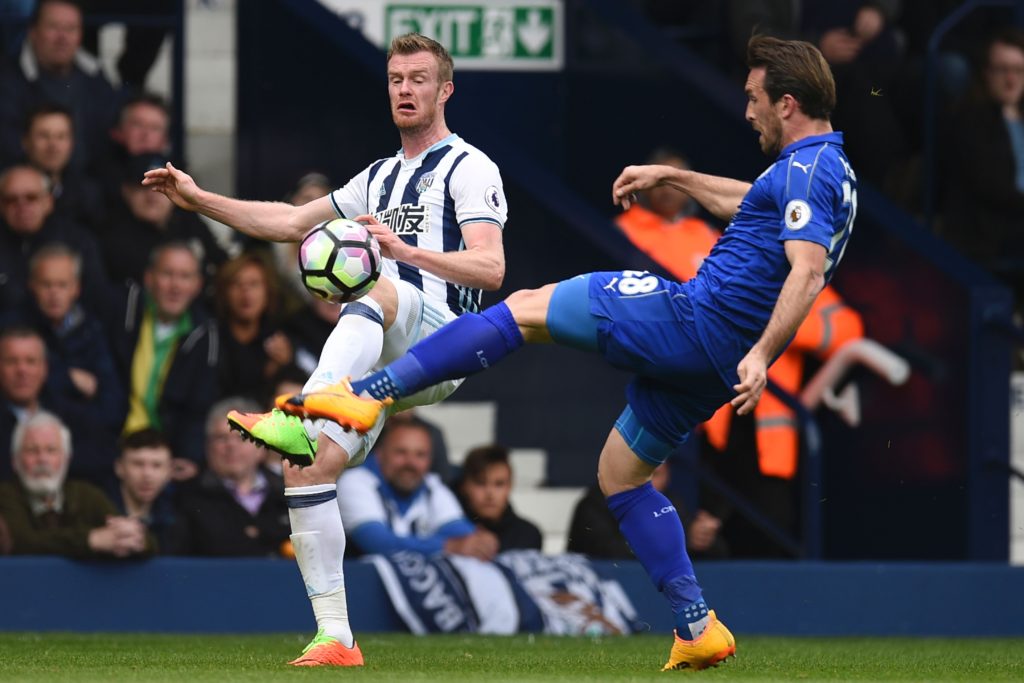 Leicester City's Austrian defender Christian Fuchs (R) vies with West Bromwich Albion's Northern Irish midfielder Chris Brunt during the English Premier League football match between West Bromwich Albion and Leicester City at The Hawthorns stadium in West Bromwich, central England, on April 29, 2017.  / AFP PHOTO / Oli SCARFF / RESTRICTED TO EDITORIAL USE. No use with unauthorized audio, video, data, fixture lists, club/league logos or 'live' services. Online in-match use limited to 75 images, no video emulation. No use in betting, games or single club/league/player publications.  /         (Photo credit should read OLI SCARFF/AFP/Getty Images)