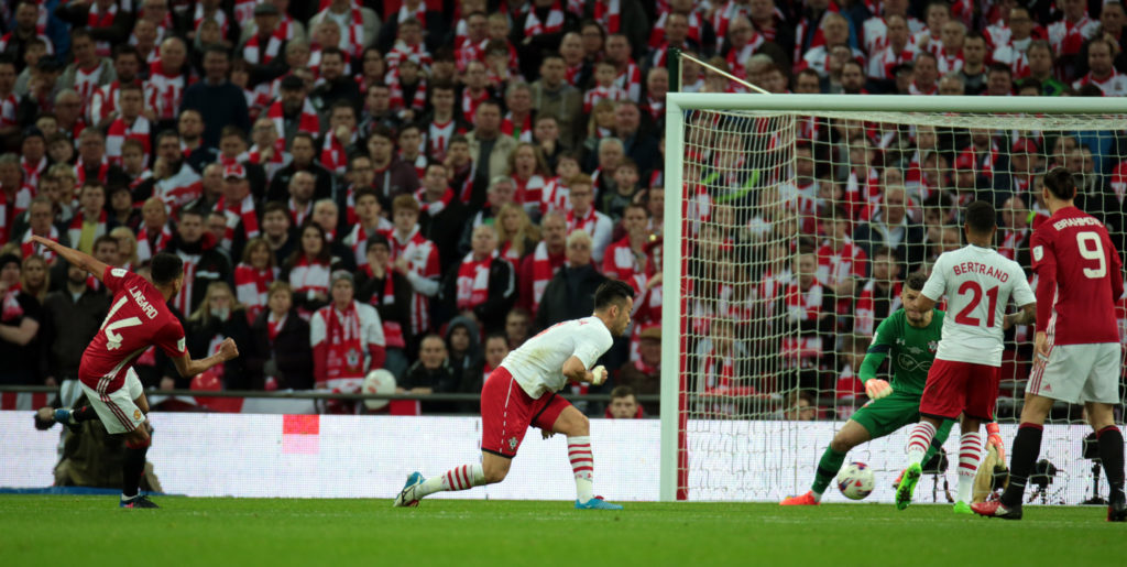 Manchester United's Jesse Lingard scores his sides second goal during the EFL Cup Final Match between Manchester United and Southampton on February 26 at the Wembley Stadium, London (Photo by Kieran Galvin/NurPhoto via Getty Images)