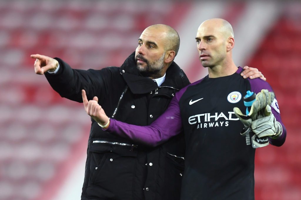 SUNDERLAND, ENGLAND - MARCH 05:  Josep Guardiola, Manager of Manchester City (L) speaks with Willy Caballero of Manchester City (R) on the ptich after the Premier League match between Sunderland and Manchester City at Stadium of Light on March 5, 2017 in Sunderland, England.  (Photo by Michael Regan/Getty Images)