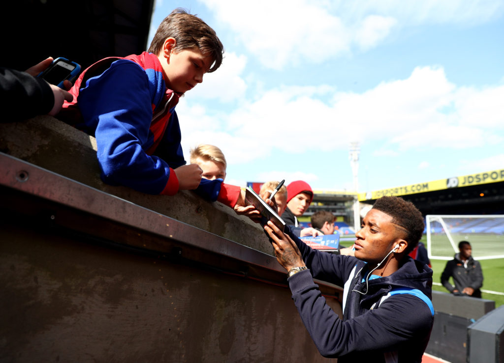 LONDON, ENGLAND - APRIL 15: Demarai Gray of Leicester City signs fans autographs as he arrives at the stadium prior to the Premier League match between Crystal Palace and Leicester City at Selhurst Park on April 15, 2017 in London, England.  (Photo by Ian Walton/Getty Images)