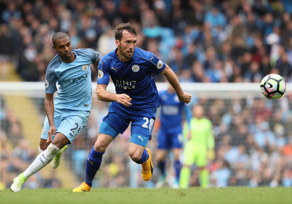 MANCHESTER, ENGLAND - MAY 13:  Christian Fuchs of Leicester City competes with Fernandinho of Manchester City during the Premier League match between Manchester City and Leicester City at Etihad Stadium on May 13, 2017 in Manchester, England.  (Photo by Matthew Ashton - AMA/Getty Images)