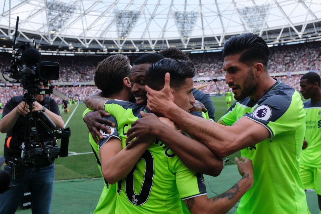 Liverpool's Brazilian midfielder Philippe Coutinho (C) celebrates with teammates Liverpool's German midfielder Emre Can (R) and Liverpool's English striker Daniel Sturridge (2L) after he scored their second goal during the English Premier League football match between West Ham United and Liverpool at The London Stadium, in east London on May 14, 2017.  / AFP PHOTO / DANIEL LEAL-OLIVAS / RESTRICTED TO EDITORIAL USE. No use with unauthorized audio, video, data, fixture lists, club/league logos or 'live' services. Online in-match use limited to 75 images, no video emulation. No use in betting, games or single club/league/player publications.  /         (Photo credit should read DANIEL LEAL-OLIVAS/AFP/Getty Images)