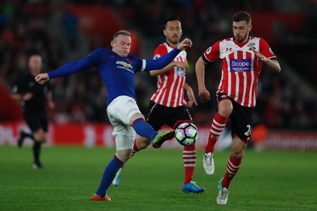 Manchester United's English striker Wayne Rooney (L) battles for the ball with Southampton's English defender Jack Stephens (R) during the English Premier League football match between Southampton and Manchester United at St Mary's Stadium in Southampton, southern England on May 17, 2017. / AFP PHOTO / Adrian DENNIS / RESTRICTED TO EDITORIAL USE. No use with unauthorized audio, video, data, fixture lists, club/league logos or 'live' services. Online in-match use limited to 75 images, no video emulation. No use in betting, games or single club/league/player publications.  /         (Photo credit should read ADRIAN DENNIS/AFP/Getty Images)