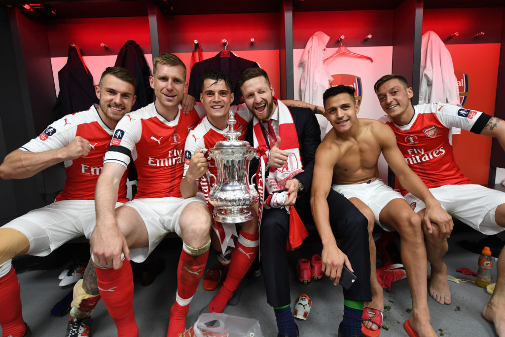 LONDON, ENGLAND - MAY 27: (L-R) Aaron Ramsey, Per Mertesacker, Granit Xhaka, Shkodran Mustafi, Alexis Sanchez and Mesut Ozil celebrate after the Emirates FA Cup Final between Arsenal and Chelsea at Wembley Stadium on May 27, 2017 in London, England. (Photo by Stuart MacFarlane/Arsenal FC via Getty Images)