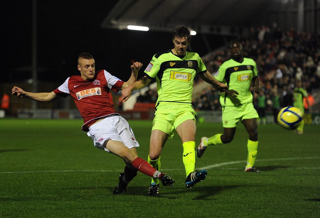 FLEETWOOD, ENGLAND - DECEMBER 02:  Jamie Vardy (L) of Fleetwood Town shoots at goal under pressure from Paul Huntington of Yeovil Town during the FA Cup sponsored by Budweiser Second Round match between Fleetwood Town and Yeovil Town on December 2, 2011 at Highbury Stadium in Fleetwood, England.  (Photo by Chris Brunskill - The FA/The FA via Getty Images)