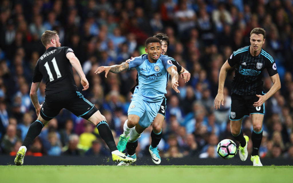 MANCHESTER, ENGLAND - MAY 16: Gabriel Jesus of Manchester City attempts to get away from Chris Brunt of West Bromwich Albion and Jonny Evans of West Bromwich Albion  during the Premier League match between Manchester City and West Bromwich Albion at Etihad Stadium on May 16, 2017 in Manchester, England.  (Photo by Clive Mason/Getty Images)