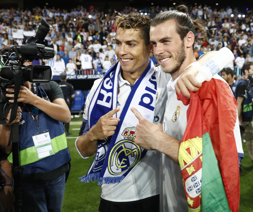 MALAGA, SPAIN - MAY 21:  Cristiano Ronaldo of Real Madrid and Gareth Bale of Real Madrid celebrate after their team are crowned champions following the La Liga match between Malaga and Real Madrid at La Rosaleda Stadium on May 21, 2017 in Malaga, Spain.  (Photo by Helios de la Rubia/Real Madrid via Getty Images)