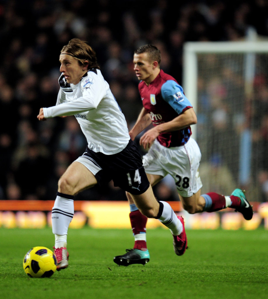 BIRMINGHAM, ENGLAND - DECEMBER 26: Luka Modric of Tottenham (L) runs under pressure from Jonathan Hogg of Aston Villa during the Barclays Premier League match between Aston Villa and Tottenham Hotspur at Villa Park on December 26, 2010 in Birmingham, England. (Photo by Shaun Botterill/Getty Images)